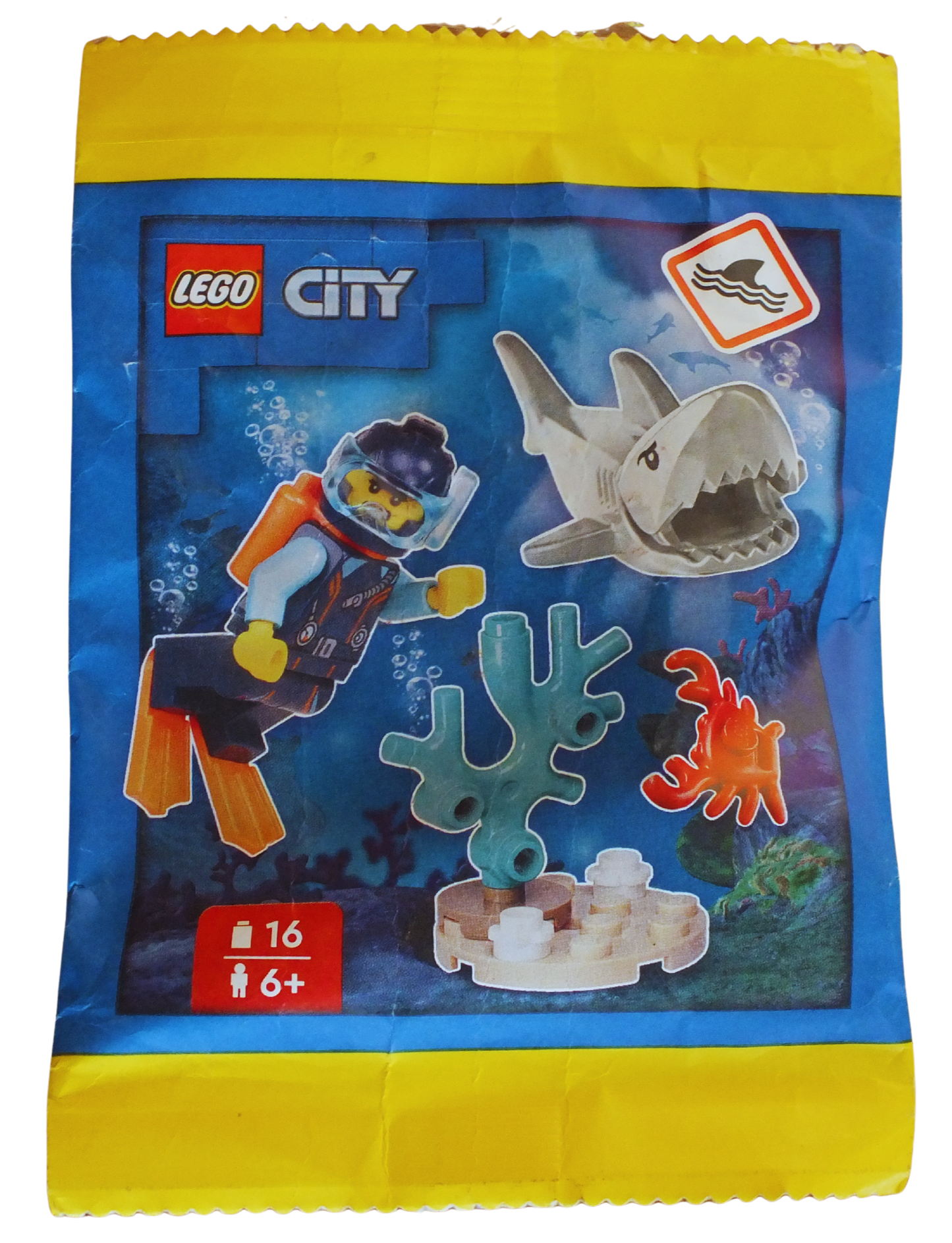 LEGO® CITY Diver paper pack featuring reef and shark illustrations, designed for creative building and educational play.