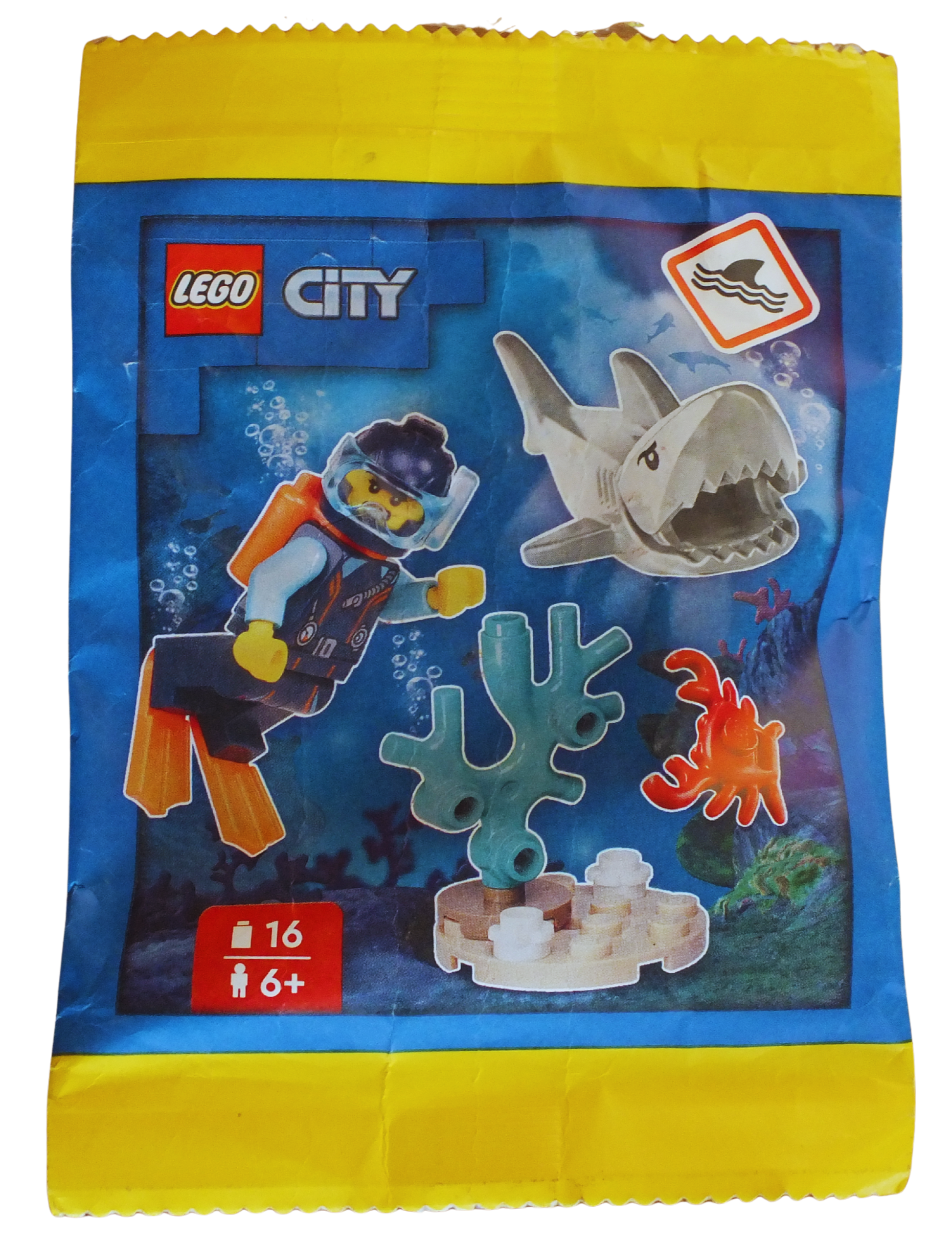 LEGO® CITY Diver paper pack featuring reef and shark illustrations, designed for creative building and educational play.